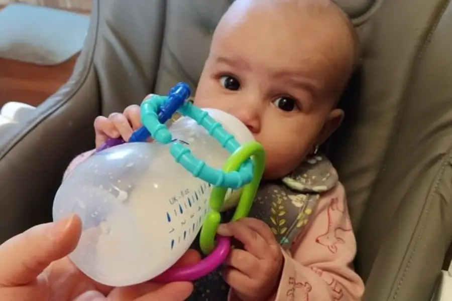 Tummy time builds the necessary strength, while encouraging upright feeding ensures safety and digestion