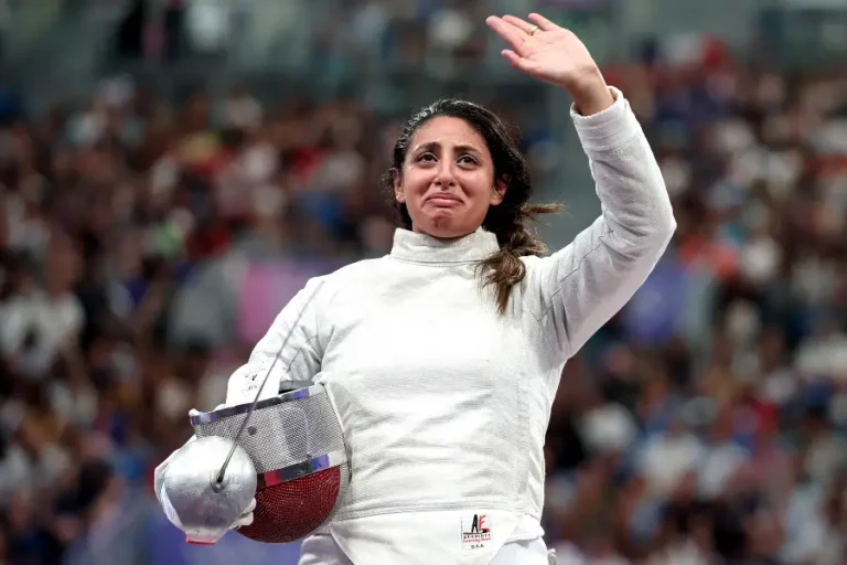 Nada Hafel waved her hand to her fans after her victory in the Fencing Women's Sabre Individual Table of 32 at Grand Palais on July 29, 2024