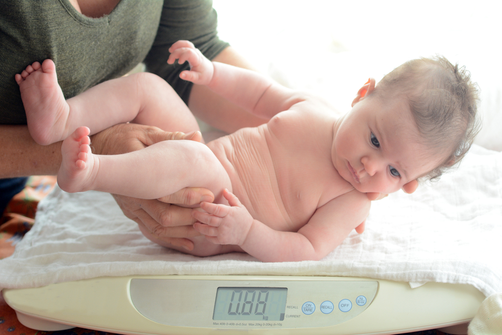 You should use a baby scale for weighing newborn at home