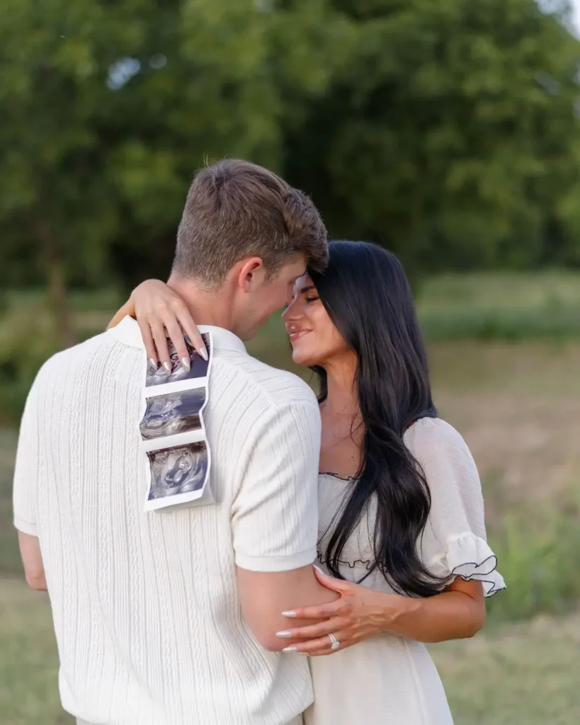 Prewett And Troutt Are Hugging Each Other While Showing Ultrasound Images