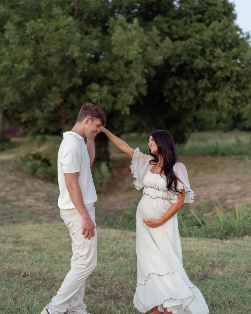 The Couple Are In A Lush, Green Field