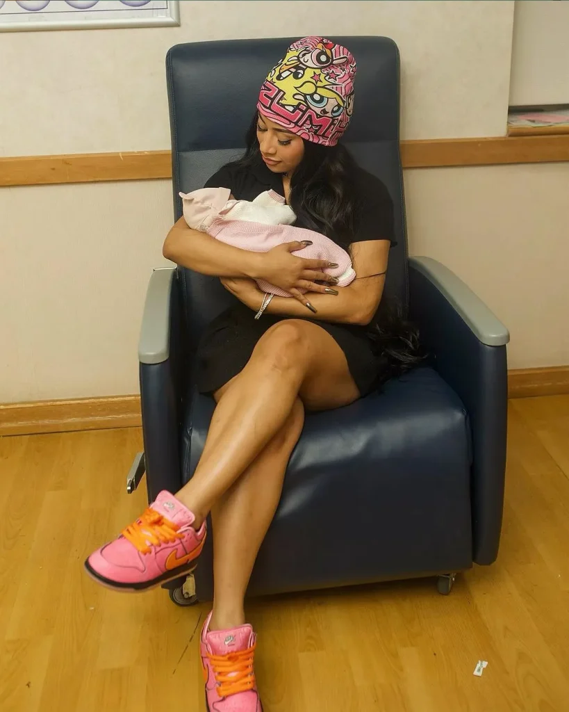 Cardi B is happy while carrying her newborn daughter in her arms