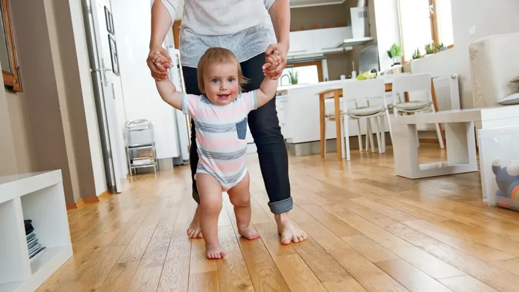 You can support your baby to encourage them to walk more