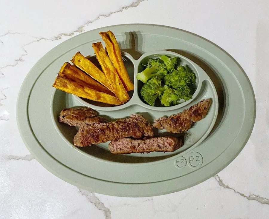 Meatballs, french fries and steamed broccoli